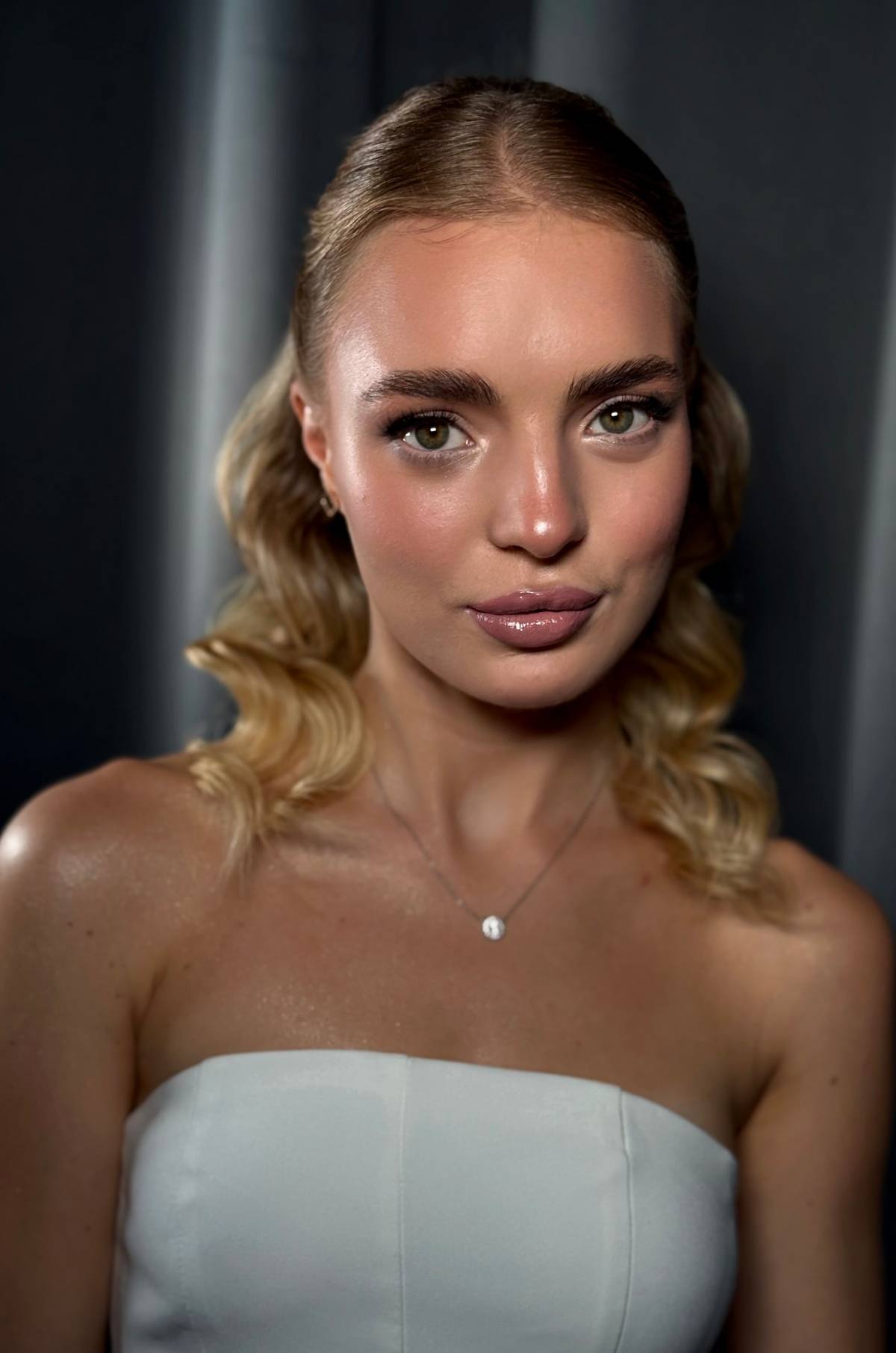 Close-up of wedding makeup: soft eye shading and an even skin tone